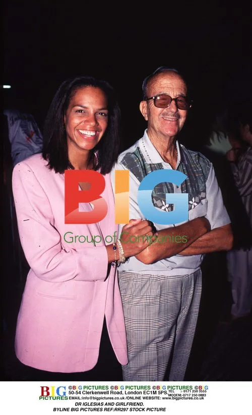 Dr Iglesias and girlfriend pose for camera