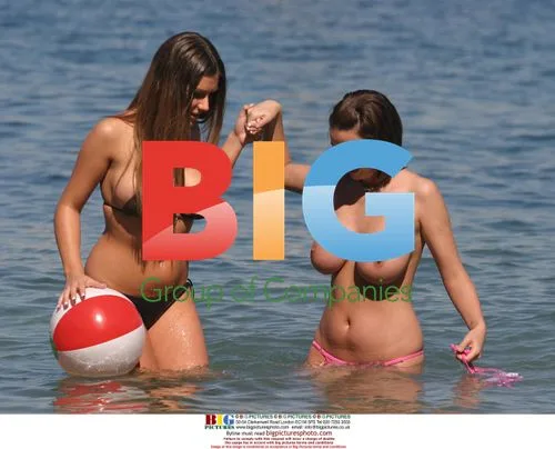 Glamour Models Lucy Pinder and Sophie Howard Playing on Beach