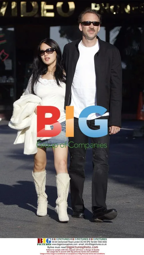 Nicolas Cage and Alice Kim with newborn