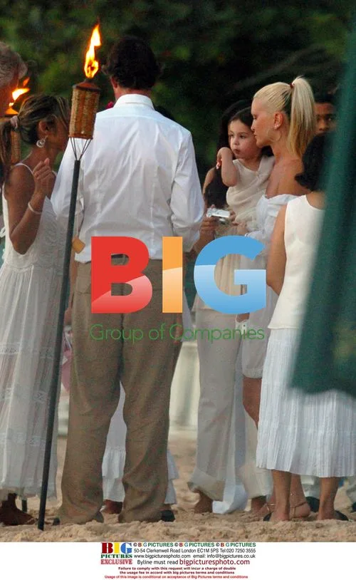 Caprice and Brian Lara at Christening