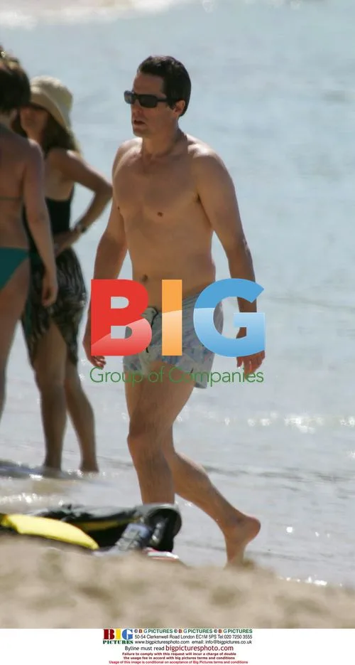 Hugh Grant Enjoys Caribbean Beach
