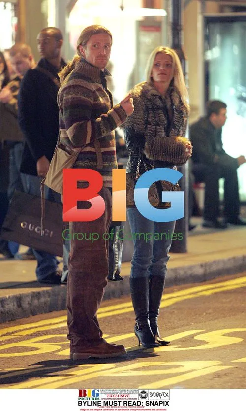Emmanuel Petit and girlfriend shopping in London