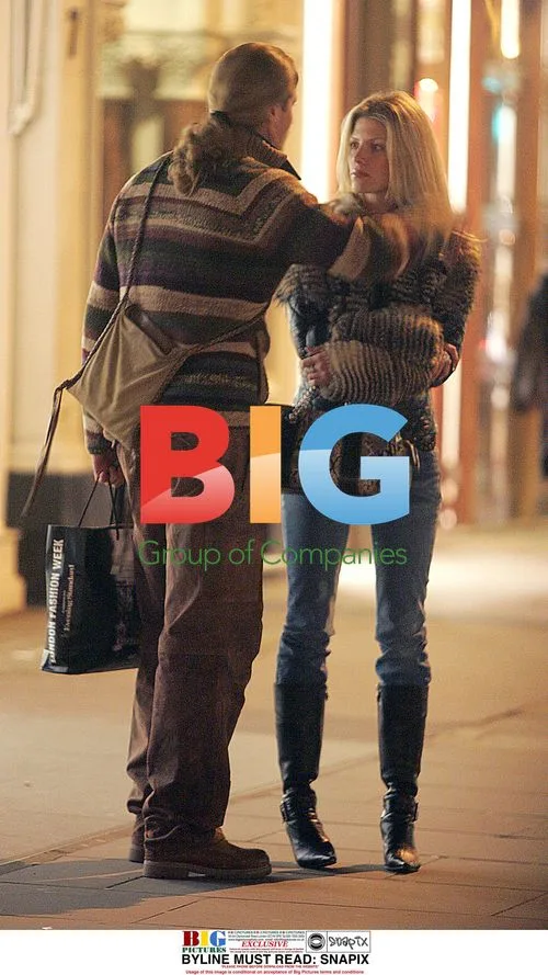 Footballer Emmanuel Petit and girlfriend shopping