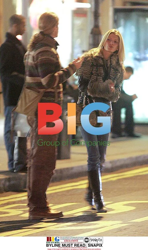 Emmanuel Petit and girlfriend on late night shopping