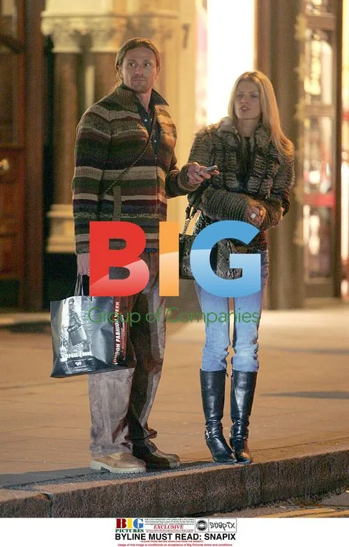 Emmanuel Petit and girlfriend on late night shopping trip