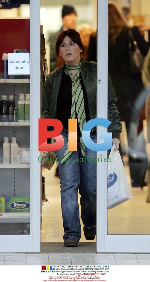 Jessie Wallace out with fiance and baby