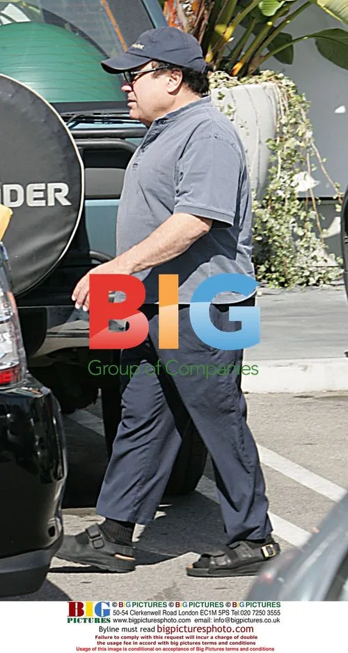 Danny DeVito on Phone in Sandals