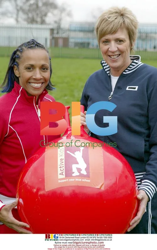 Dame Kelly Homes with PE teacher Debbie Page