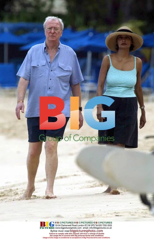 Michael Caine and wife Shakira take beach stroll