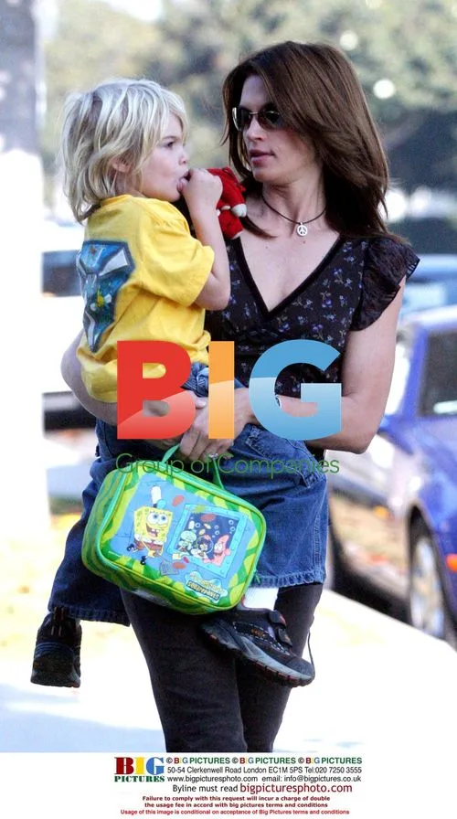 Cindy Crawford's Son Carried to School