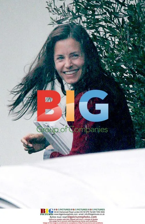 Courtney Cox Leaving Studio in Rain