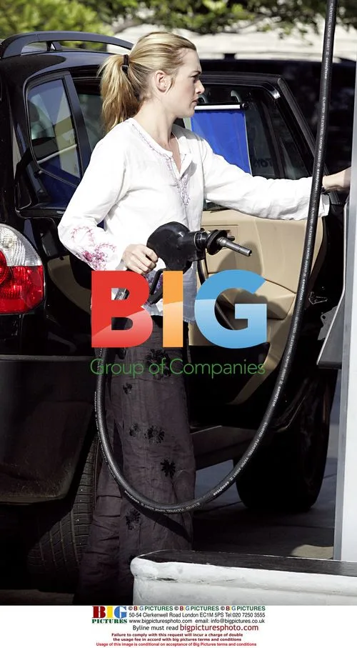 Kate Winslet Struggles with Gas Can
