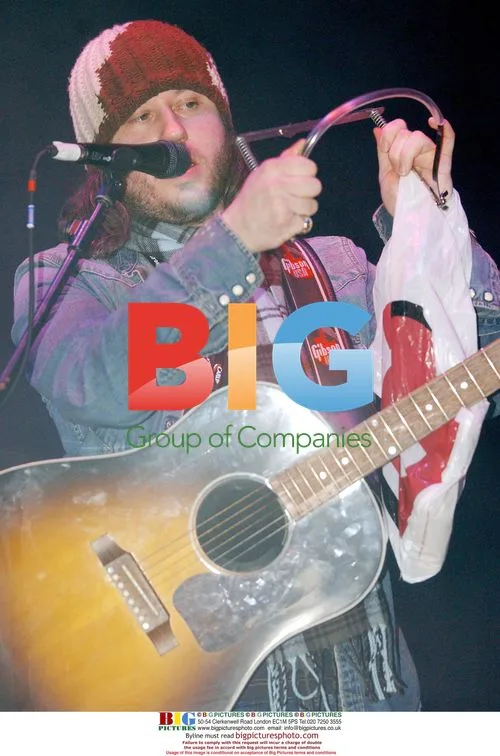 Badly Drawn Boy Holds Dylan's Harmonica