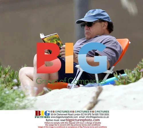 Danny DeVito Reading Book at Home
