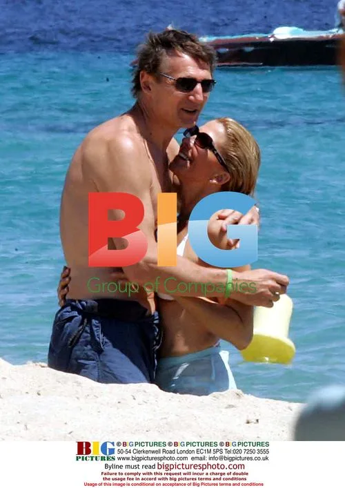 Liam Neeson and Wife on Beach in France