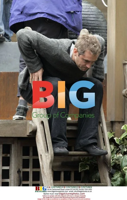 Jude Law and Anthony Minghella filming "Breaking and Entering"