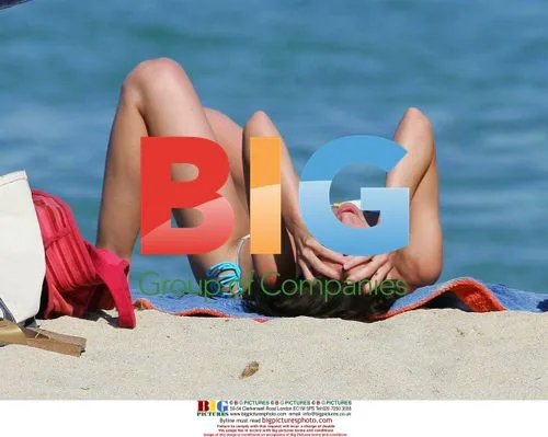 Claire Forlani Sunbathing on Beach