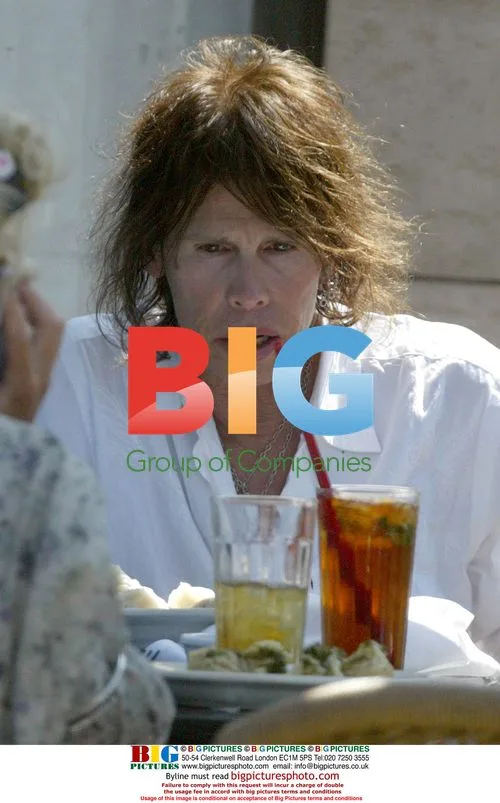 Steven Tyler Relaxing at Sunset Plaza
