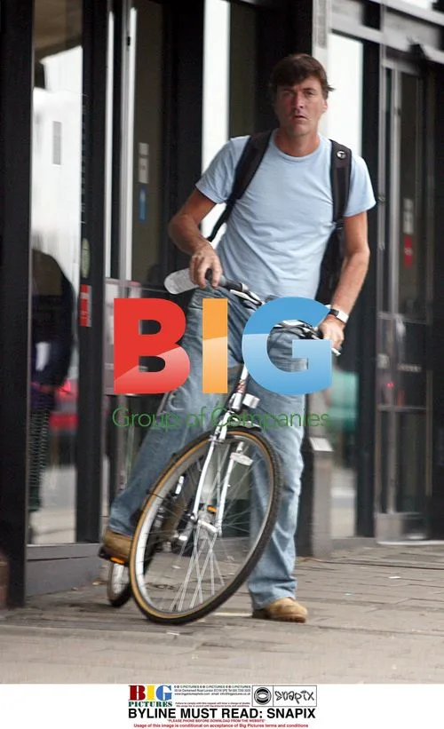 Richard Madeley rides bike in London