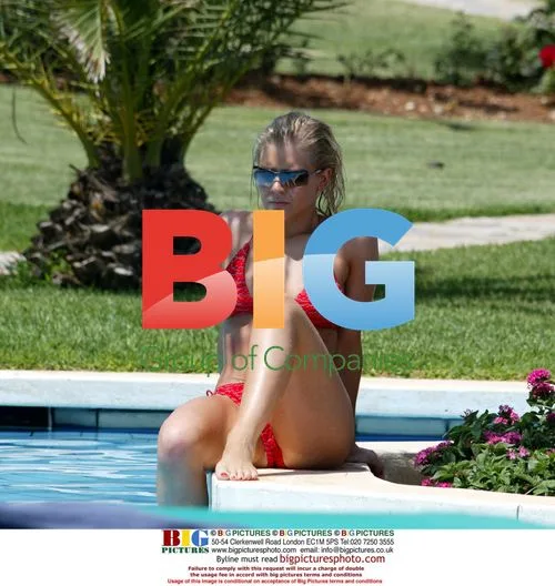 Suzanne Shaw relaxes by pool