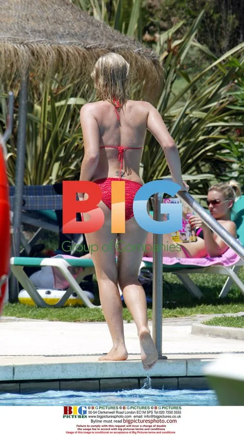 Suzanne Shaw Relaxes by Pool