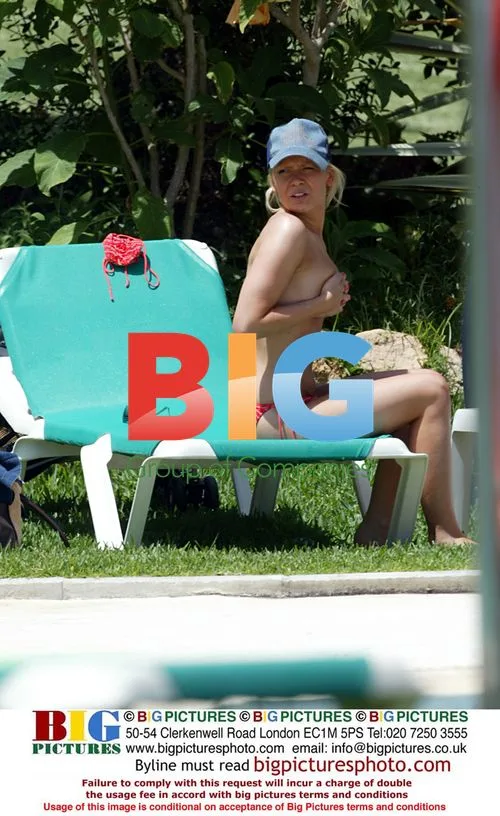 Singer Suzanne Shaw Sunbathes by Pool