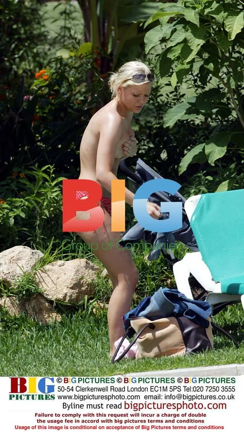 Suzanne Shaw relaxes by the pool
