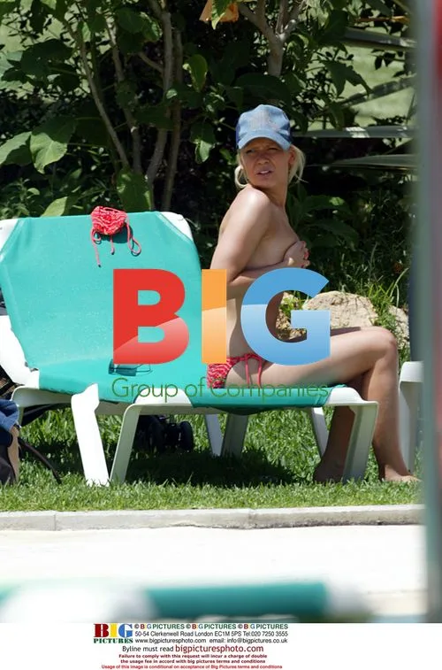 Singer Suzanne Shaw Sunbathes by Pool in Grand Canaries