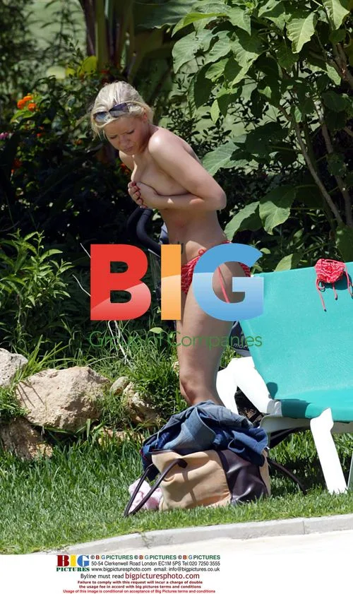 Suzanne Shaw Relaxes by Pool in Grand Canaries