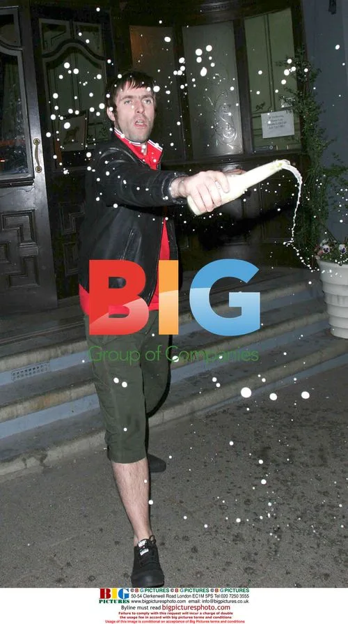 Liam Gallagher soaks paps with beer