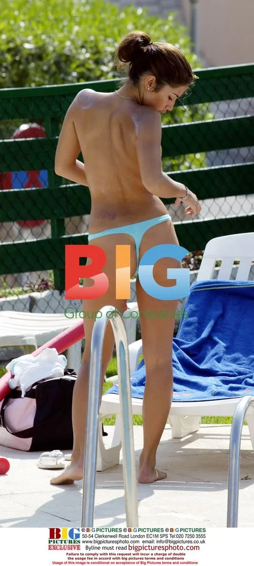 Glamour girls Leilani and Lucy Becker by pool