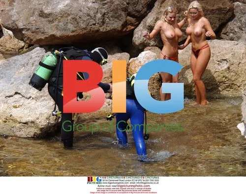 Glamour models play on rocks in Spain