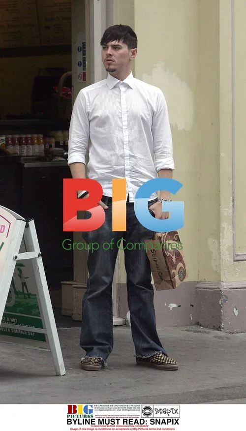 Matt Jay Grabs Water at London Coffee Shop