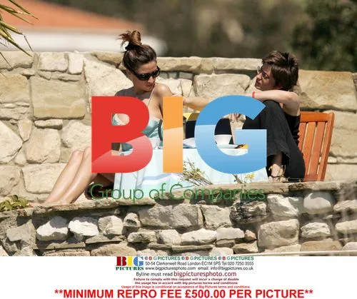 Rebecca Loos and friend relax poolside in Cyprus