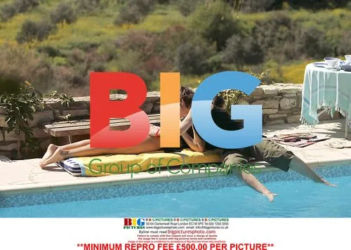 Rebecca Loos and friend relax poolside in Cyprus