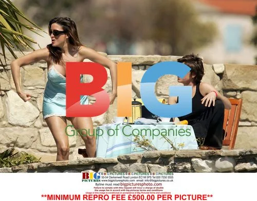 Rebecca Loos and friend relax poolside in Cyprus
