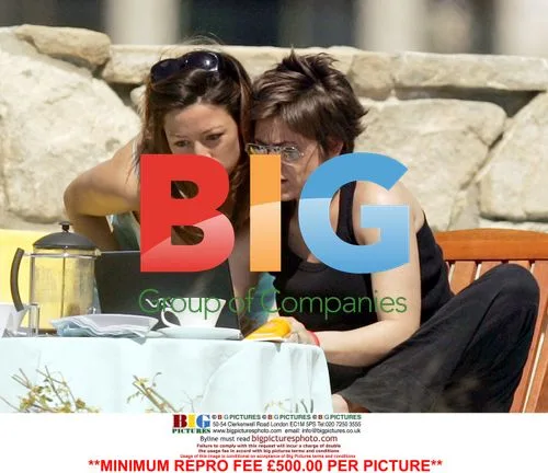 Rebecca Loos and friend relax poolside in Cyprus