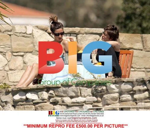 Rebecca Loos and friend relax poolside in Cyprus