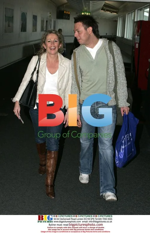 Lucy Benjamin and friend Chris Dennis depart Heathrow