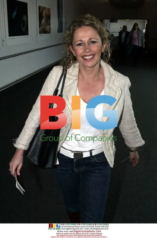 Lucy Benjamin and Chris Dennis depart Heathrow