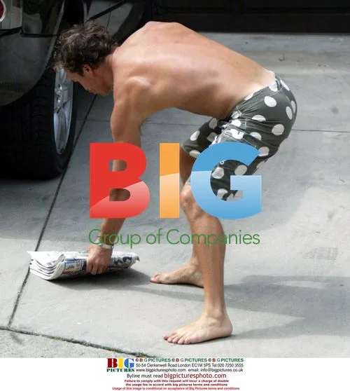 Matthew McConaughey brushing teeth while grabbing paper