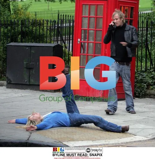 Rhys Ifans chatting on phone in London