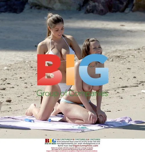 Glamour models Lucy Pinder and Sophie Howard on beach
