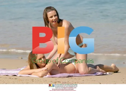 Glamour Models Relax on Beach in France