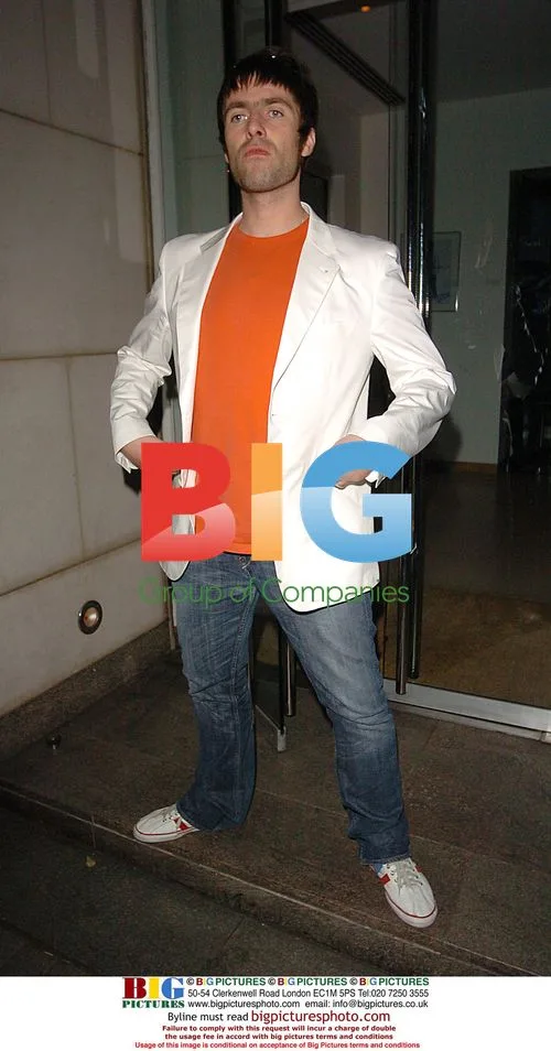 Liam Gallagher poses outside Nobu restaurant