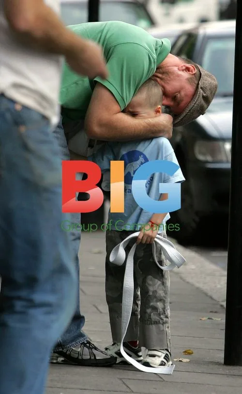 Guy Ritchie comforts upset son Rocco at martial arts class