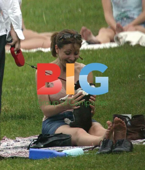 Kerrie Taylor Enjoys Park Outing with Dog and Boyfriend