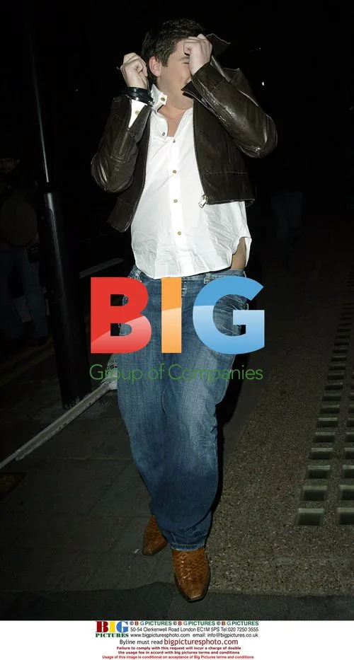Craig Coates and friend leaving charity event