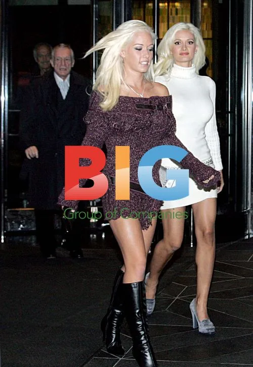 Hugh Hefner leaves hotel with 'Girls Next Door'