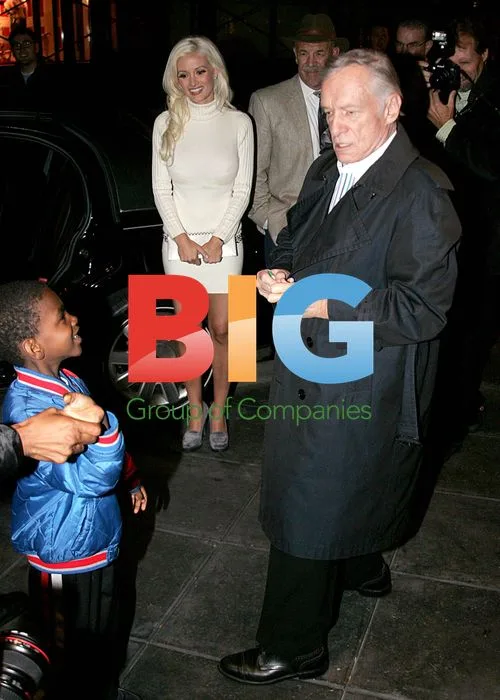 Hugh Hefner leaves hotel with 'Girls Next Door' stars